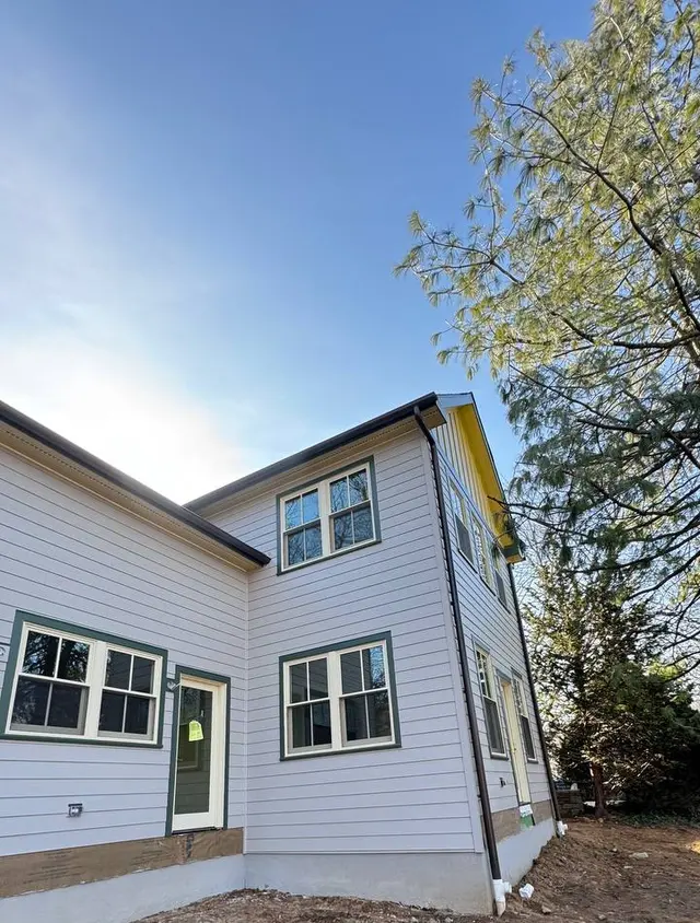 Seamless dark gutters and downspout on a new construction home in Pennsylvania